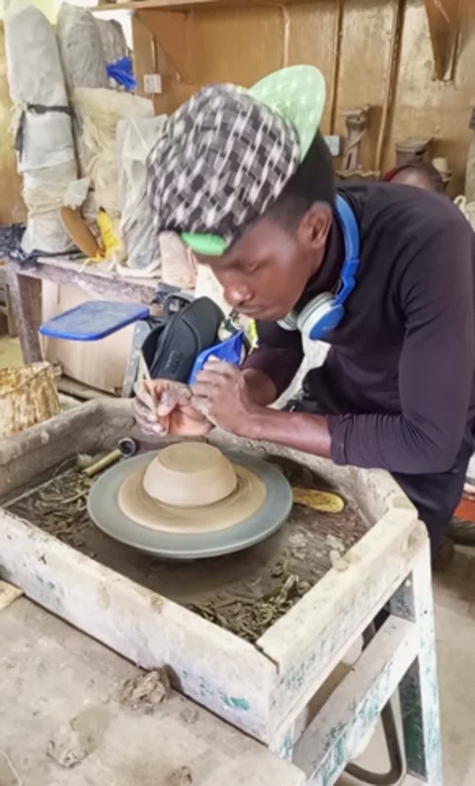 At the potter's wheel
